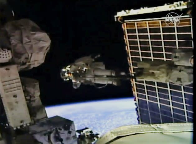 NASA astronaut Christina Koch floats on the end of the International Space Station’s robotic arm during a spacewalk. (NASA via YouTube)