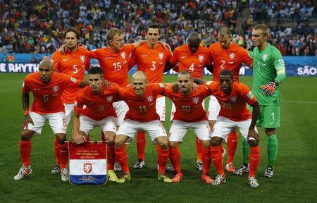 Netherlands national soccer players pose for a team photo before their 2014 World Cup semi-finals against Argentina at the Corinthians arena in Sao Paulo July 9, 2014. REUTERS/Michael Dalder