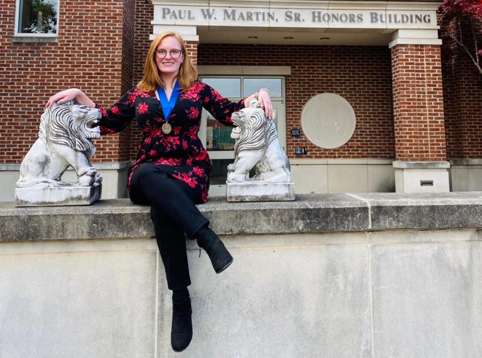 Sporting the Middle Tennessee State University Honors College thesis medal, Elizabeth Kowalczyk of Huntsville, Ala., sits outside the Paul W. Martin Sr. Honors Building after successfully defending her thesis. A senior Forensic Science major and Honors student, Kowalczyk was recently named a 2023 Goldwater Scholar by the Barry Goldwater Scholarship and Excellence in Education Foundation to encourage outstanding undergraduate students to pursue careers in science, technology, engineering, and mathematics research.