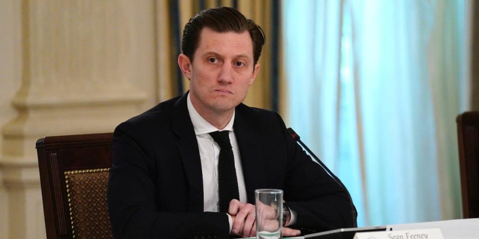 Sean Feeney, co-founder of Grovehouse, listens as President Donald Trump speaks during a meeting with restaurant industry executives about the coronavirus response, in the State Dining Room of the White House, Monday, May 18, 2020, in Washington.