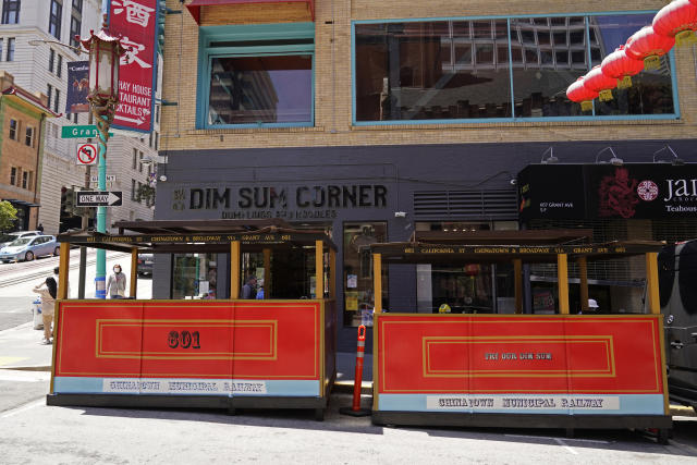 A pair of Cable Car shaped parklets are seen outside a Chinatown Dim Sum restaurant in San Francisco, Monday, May 23, 2022. Chinatowns and other Asian American enclaves across the U.S. are using art and culture to show they are safe and vibrant hubs nearly three years after the start of the pandemic. From an inaugural arts festival in San Francisco to night markets in New York City, the rise in anti-Asian hate crimes has re-energized these communities and drawn allies and younger generations of Asian and Pacific Islander Americans.(AP Photo/Eric Risberg)
