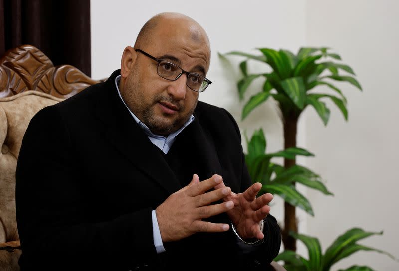 Zakaria Abu Maamar, a member of Hamas political office reacts during an interview with Reuters in his office in Gaza City