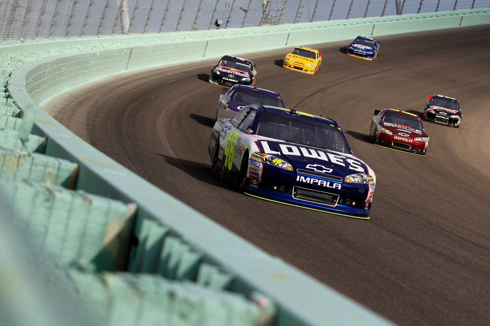 HOMESTEAD, FL - NOVEMBER 20: Jimmie Johnson, driver of the #48 Lowe's Chevrolet, leads the field during the NASCAR Sprint Cup Series Ford 400 at Homestead-Miami Speedway on November 20, 2011 in Homestead, Florida. (Photo by Chris Trotman/Getty Images for NASCAR)