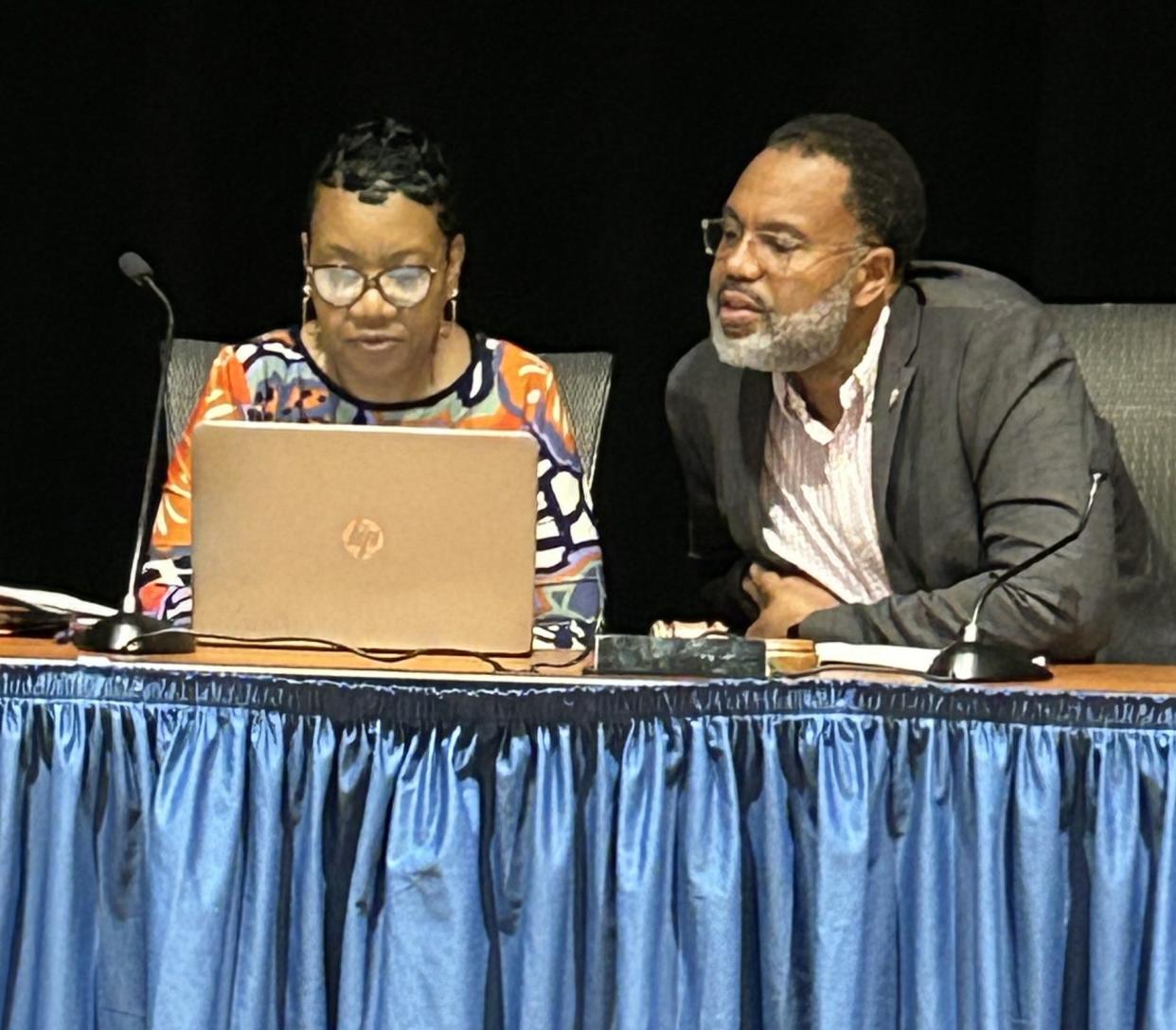 Petersburg Mayor Sam Parham, right, goes over a document with City Clerk Tangi Hill after a City Council meeting Wednesday, May 1, 2024, at the Petersburg Public Library.