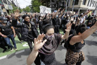 Demonstrators leave a rally and head toward Seattle City Hall Wednesday, June 3, 2020, in Seattle, following protests over the death of George Floyd, a black man who died in police custody in Minneapolis. (AP Photo/Elaine Thompson)