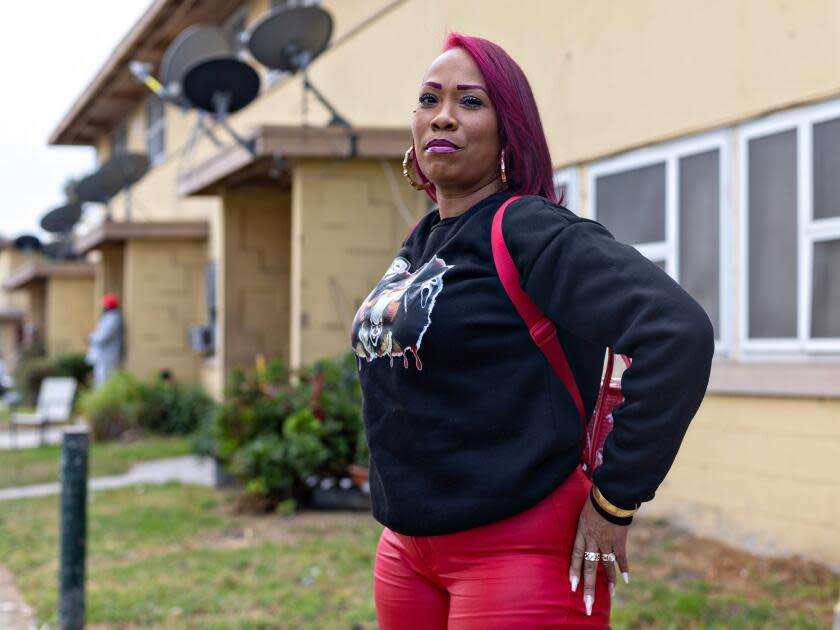 Janie Jones, who has lived at Nickerson Gardens since she was 6, pauses before Top Dawg Entertainment's annual event Tuesday in Los Angeles.