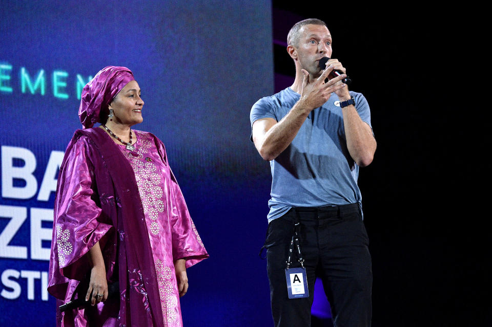 NEW YORK, NEW YORK - SEPTEMBER 28: Amina Mohammed (L) and Chris Martin speak onstage during the 2019 Global Citizen Festival: Power The Movement in Central Park on September 28, 2019 in New York City. (Photo by Theo Wargo/Getty Images for Global Citizen)