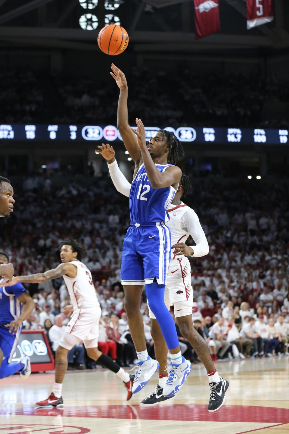 Mar 4, 2023; Fayetteville, Arkansas, USA; Kentucky Wildcats guard Antonio Reeves (12) shoots the ball against the Arkansas Razorbacks in the first half at Bud Walton Arena. Mandatory Credit: Nelson Chenault-USA TODAY Sports