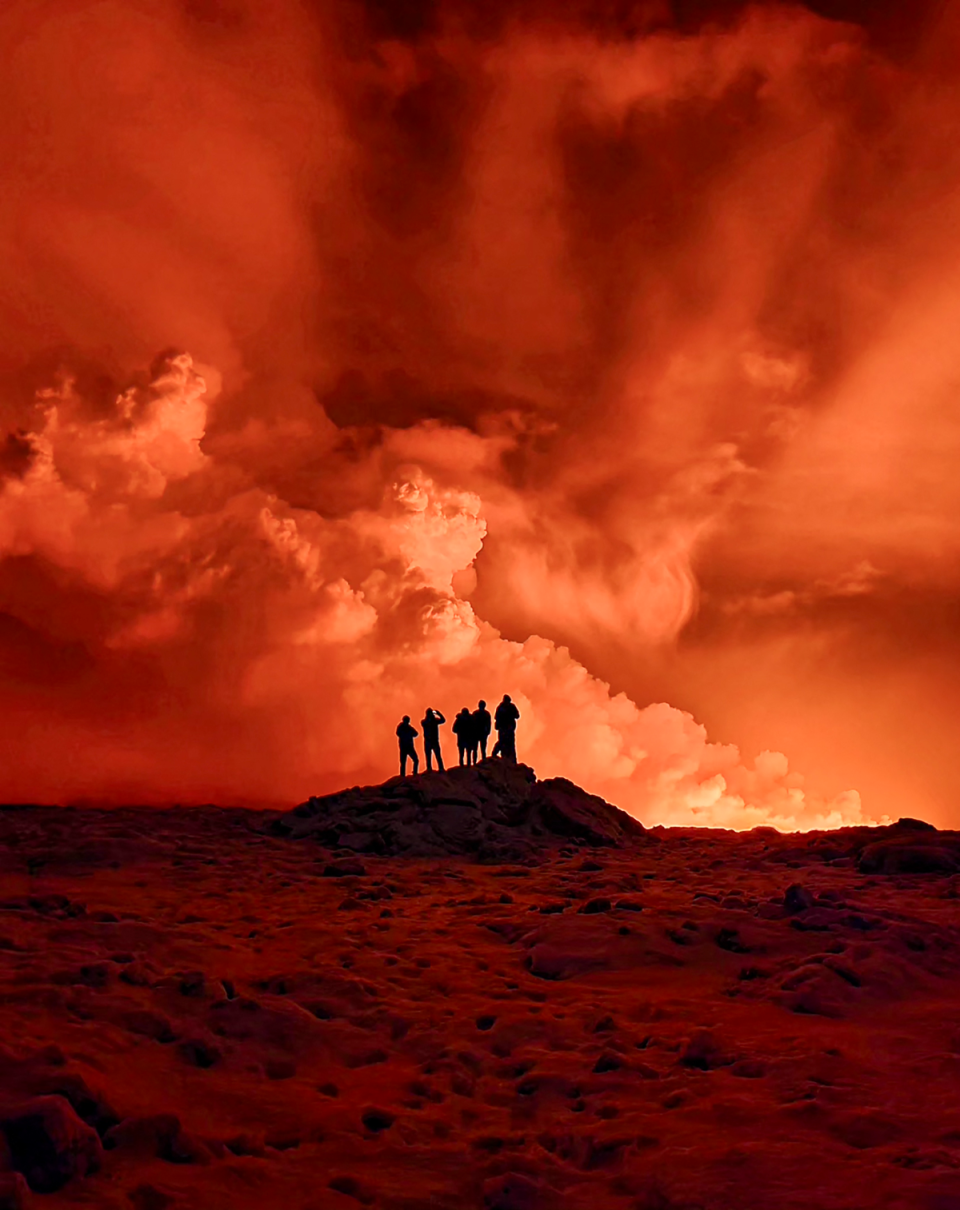 People view the volcano on the Reykjanes peninsula (AFP via Getty Images)