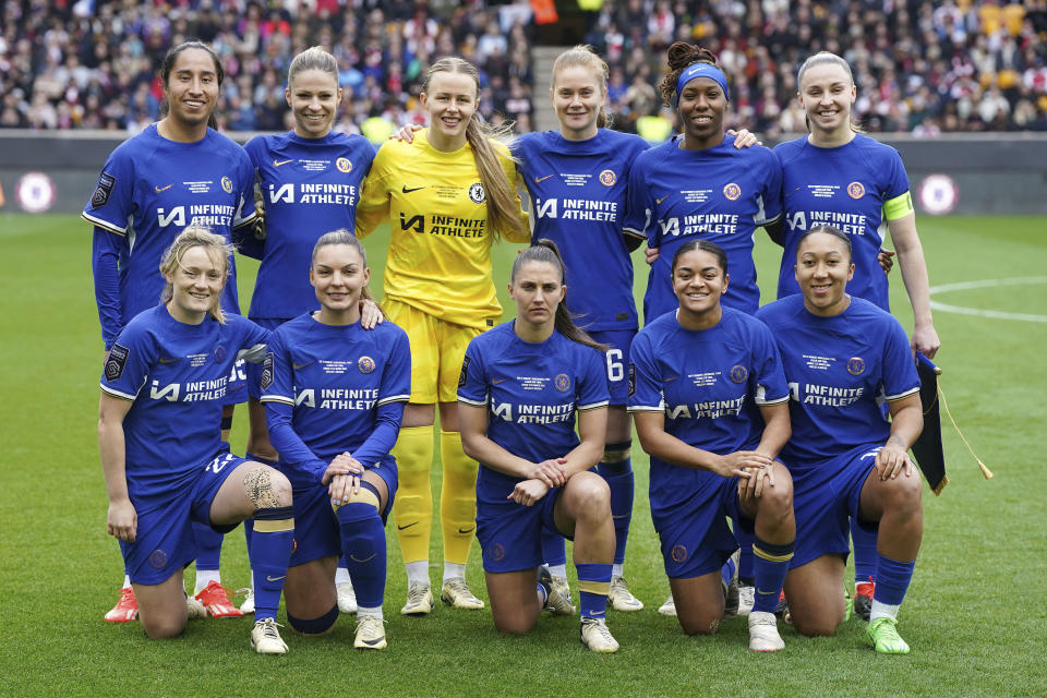 Chelsea players pose for a team photograph ahead of the FA Women's Continental Tyres League Cup Final at Molineux Stadium, Wolverhampton, England, Sunday March 31, 2024. (Nick Potts/PA via AP)