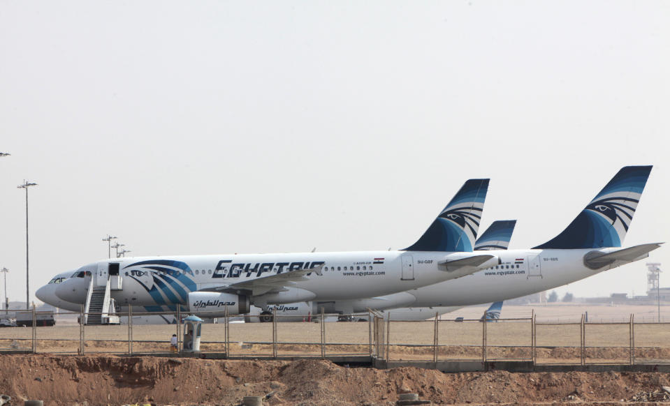 FILE - In this Thursday, Oct. 6, 2011 file photo, planes are seen parked at the Cairo International airport in Egypt. Cairo airport officials say seven flights to Egypt have been canceled and that others are arriving with less than 50 percent occupancy following weekend clashes that killed scores. (AP Photo/Amr Nabil, File)