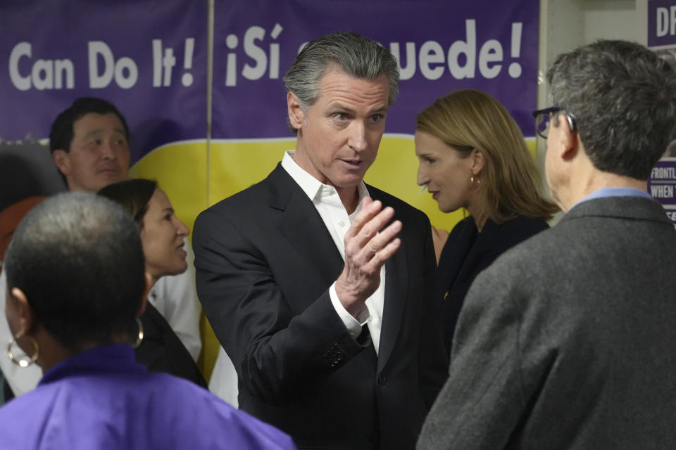 California Gov. Gavin Newsom speaks with people at a Proposition 1 campaign event at the Service Employees International Union office in San Francisco, Monday, March 4, 2024. Californians are set to vote Tuesday on a statewide ballot measure that is touted by Newsom as a major step to tackle homelessness and would be the first major update to the state’s mental health system in 20 years. (AP Photo/Terry Chea)