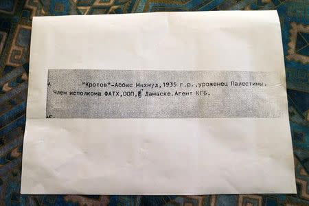 A page received by Gideon Remez, one of the Israeli researchers who said on Thursday that Soviet-era documents showed that Palestinian President Mahmoud Abbas worked in the 1980s for the KGB, the now-defunct Russian intelligence agency, with a line in Russian reading, " "Krotov", which is the derived from the Russian word for "mole" and, "Abbas, Mahmoud, born 1935 in Palestine, member of the central committee of Fatah and the PLO, in Damascus 'agent of the KGB' ", is seen during an interview with Reuters in Jerusalem September 8, 2016. REUTERS/Ammar Awad