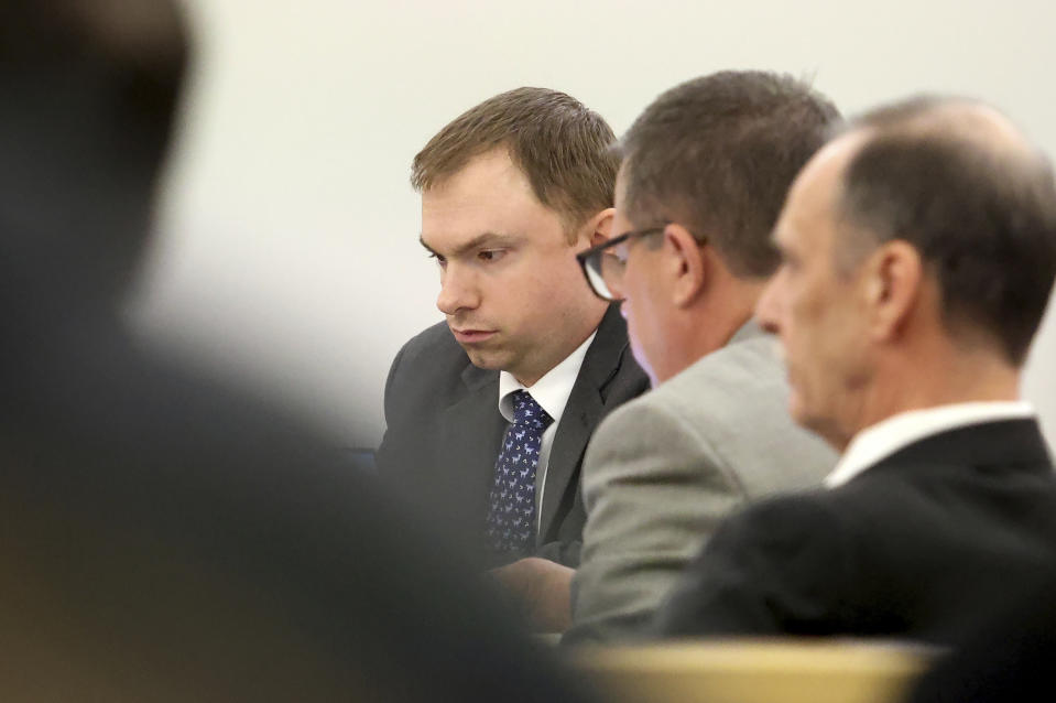 Aaron Dean listens to testimony during the sentencing phase of his trial at Tarrant County's 396th District Court on Friday, Dec. 16, 2022, in Fort Worth, Texas. Dean, a former Fort Worth police officer, was found guilty of manslaughter in the 2019 shooting death of Atatiana Jefferson. (Amanda McCoy/Star-Telegram via AP, Pool)