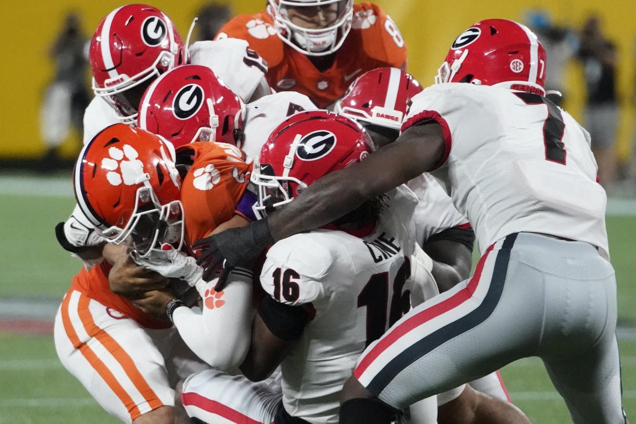 Clemson's D.J. Uiagalelei is tackled by Georgia players during the second half of a college football game on Sept. 4. (AP)
