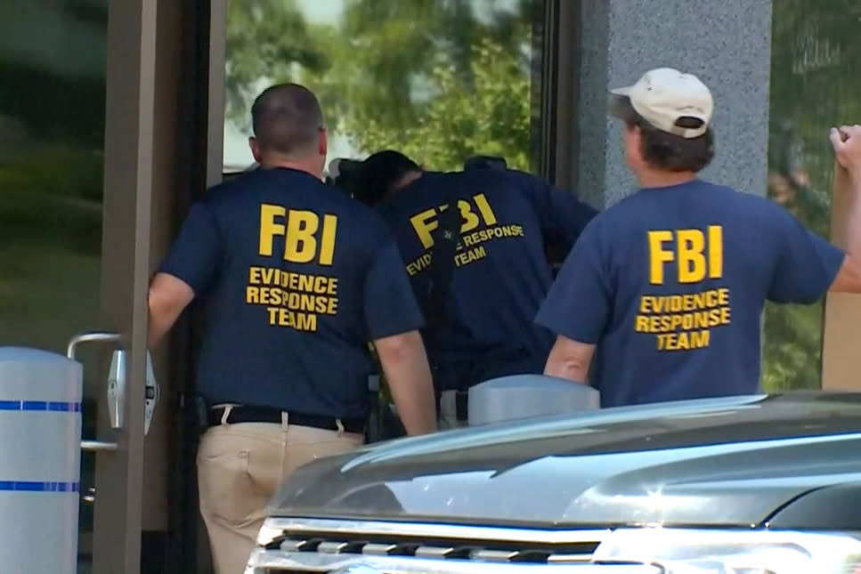 FBI Evidence Response Team gather evidence at the FBI building in Cincinnati on Thursday. (WLWT)