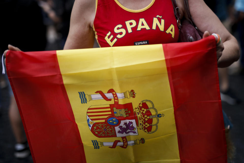 <p>A protestor holds a Spanish flag during a demonstration called by far-right groups against a referendum on independence for Catalonia, on Oct. 1, 2017 in Barcelona. (Photo: Fabio Bucciarelli/AFP/Getty Images) </p>