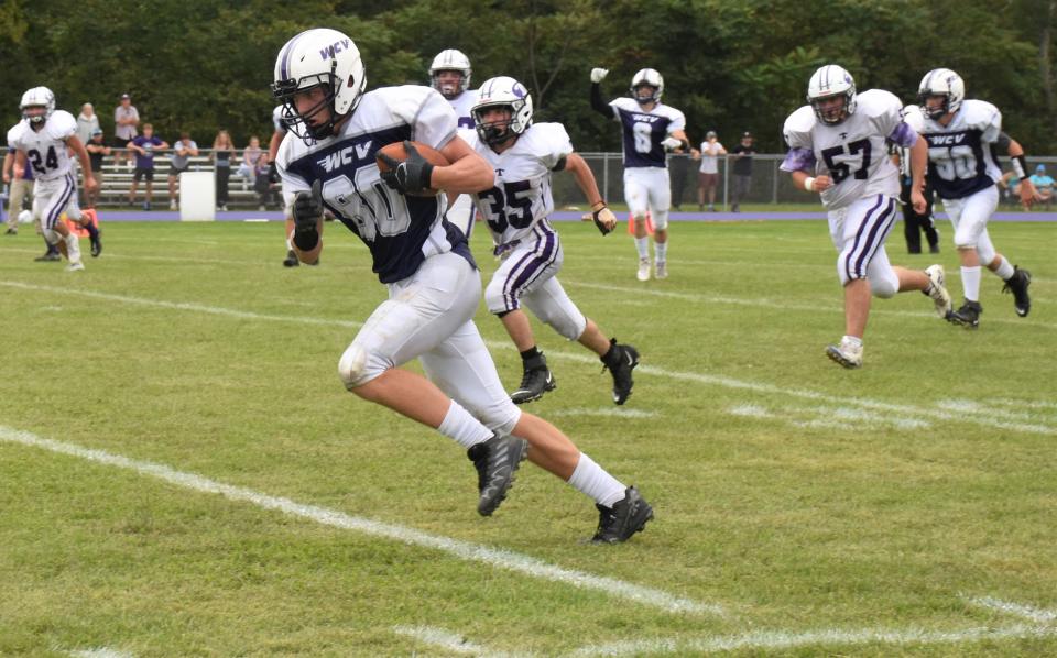 Iain Farber (80) runs with the ball for West Canada Valley on the way to his first touchdown of the season against Ticonderoga. Farber scored on pass plays covering 35 and 58 yards Saturday.