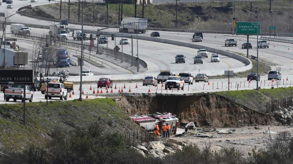 The highway near San Bernardino collapsed after storms and heavy rain. Source: AP