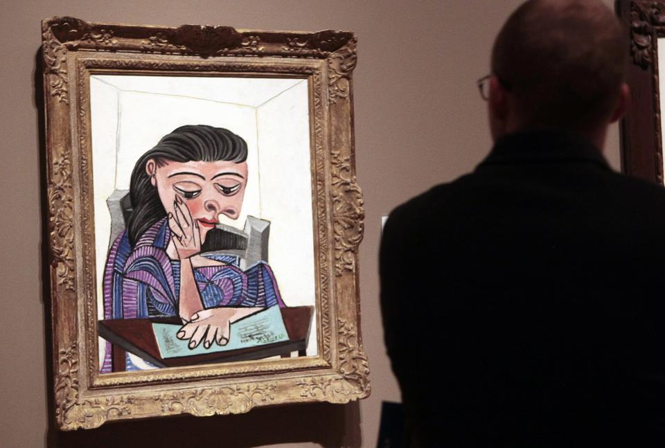 A visitor stops to look at a painting by Picasso at the Detroit Institute of Arts in Detroit in this file photo