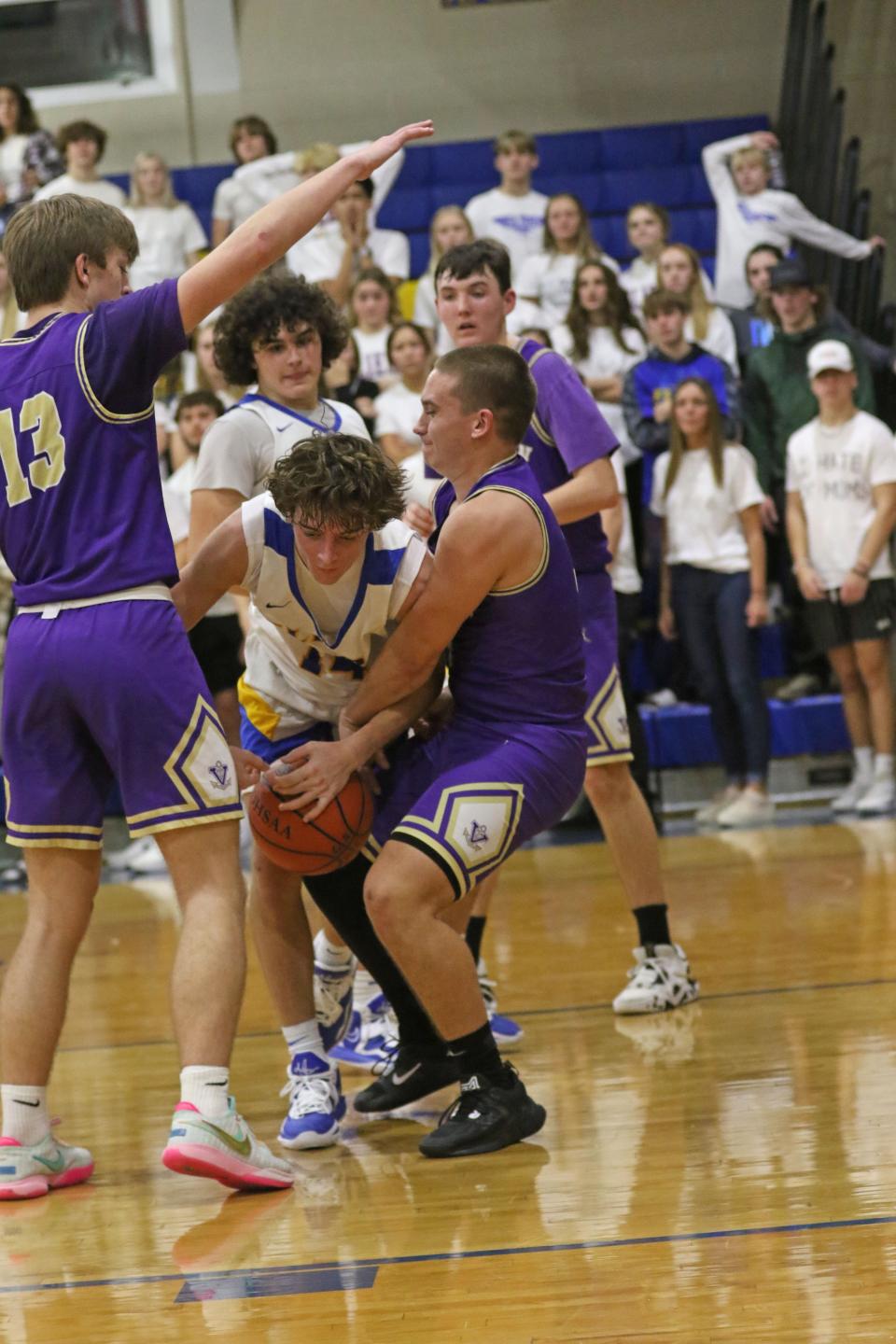 Clyde's Brennan Wilson fights for a loose ball.