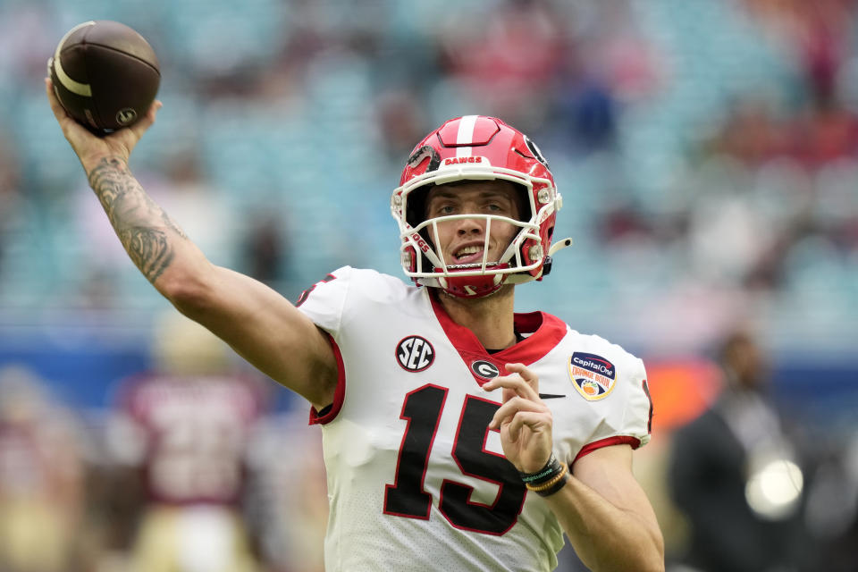 FILE - Georgia quarterback Carson Beck (15) during the first half of Orange Bowl NCAA college football game against Florida State, Saturday, Dec. 30, 2023, in Miami Gardens, Fla. The quarterback pecking order for the 2025 NFL draft still seems fluid going into this college football season, with Beck, Colorado's Shedeur Sanders and Texas' Quinn Ewers getting the most preseason buzz. (AP Photo/Lynne Sladky, File)