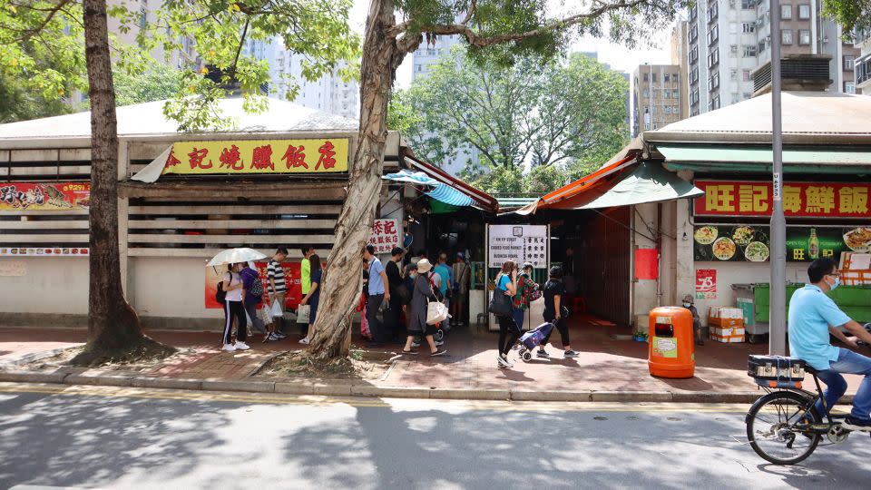 Lines are seen outside Tim Kee at Yuen Long's Kin Yip Street. Its Cantonese roasts sell out by around 1 p.m. each day. - Maggie Wong/CNN