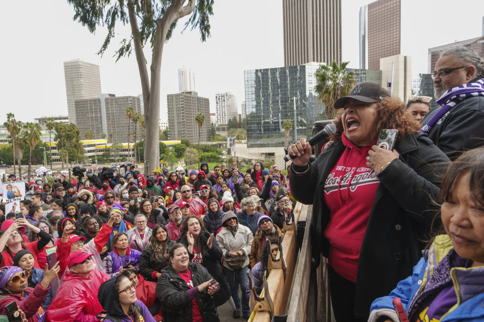 Cecily Myart-Cruz, United Teachers Los Angeles, UTLA President, with Max Arias, executive director of the Service Employees International SEIU Local 99 union, speak to thousands of Los Angeles Unified School District teachers and SEIU members rallying outside the LAUSD headquarters in Los Angeles Tuesday, March 21, 2023. Thousands of service workers backed by teachers began a three-day strike against the Los Angeles Unified School District on Tuesday, shutting down education for a half-million students in the nation's second-largest school system.(AP Photo/Damian Dovarganes)