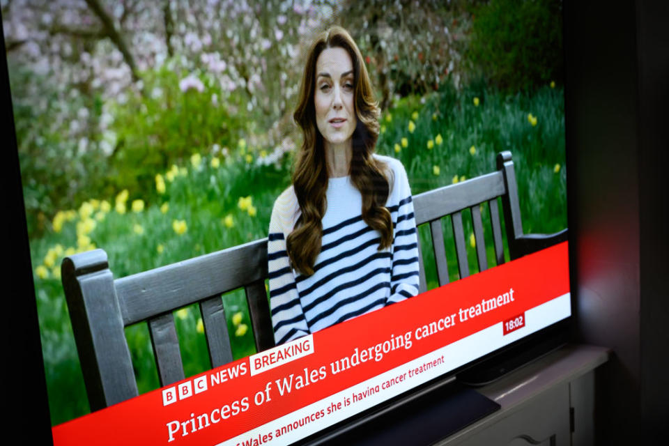 A screen displays a news report, as Catherine, The Princess of Wales announces that she is receiving a preventative course of chemotherapy for cancer on March 22, 2024, in London, England. <span class="copyright">Leon Neal-Getty Images</span>