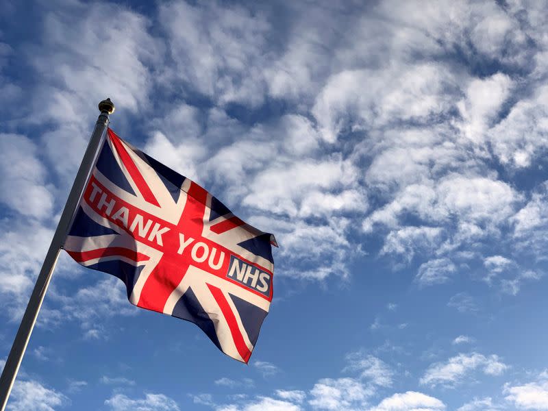 The British flag with the words thank you NHS is caught in a breeze in London