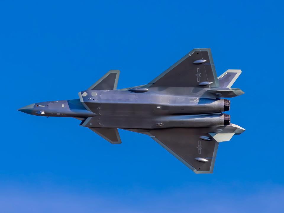 J-20 stealth fighter jet flies in the sky before the upcoming Airshow China 2021 on September 25, 2021 in Zhuhai, Guangdong Province of China.