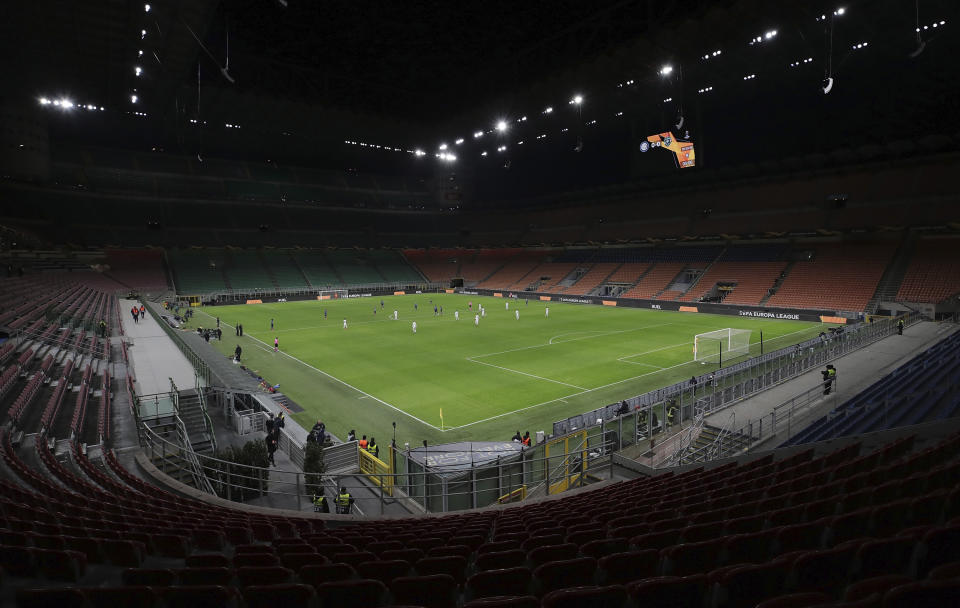 A general view inside the empty San Siro stadium in Milan, Italy during the Europa League round of 32 second leg soccer match between Inter Milan and Ludogorets on Thursday Feb. 27, 2020. Inter beat Ludogorets 2-1 in an empty stadium as a precaution because of the virus outbreak in Italy. (Emilio Andreoli, UEFA via AP)