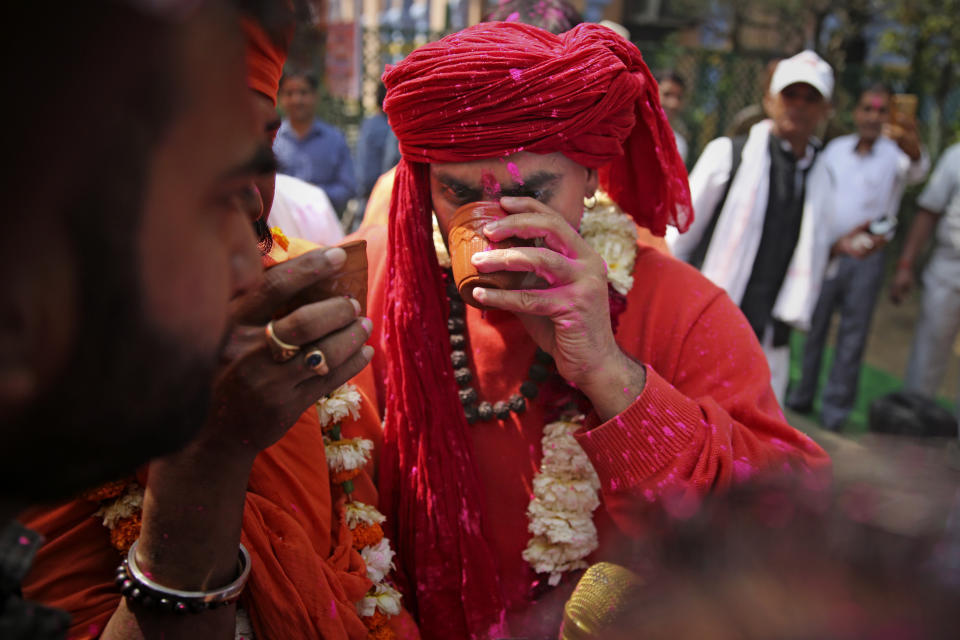 National president of Akhil Bhartiya Hindu Mahasabha Swami Chakrapani Maharaj drinks cow urine during an event organized by a Hindu religious group to promote consumption of cow urine as a cure for the new coronavirus in New Delhi, India, Saturday, March 14, 2020. The vast majority of people recover from the new coronavirus. According to the World Health Organization, people with mild illness recover in about two weeks, while those with more severe illness may take three to six weeks to recover. (AP Photo/Altaf Qadri)