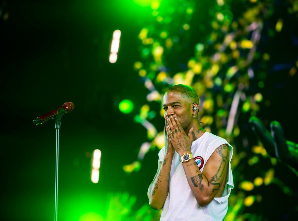 Kid Cudi gestures to the crowd after a song in his set in the Sahara tent during the Coachella Valley Music and Arts Festival in Indio, Calif., Sunday, April 21, 2024.