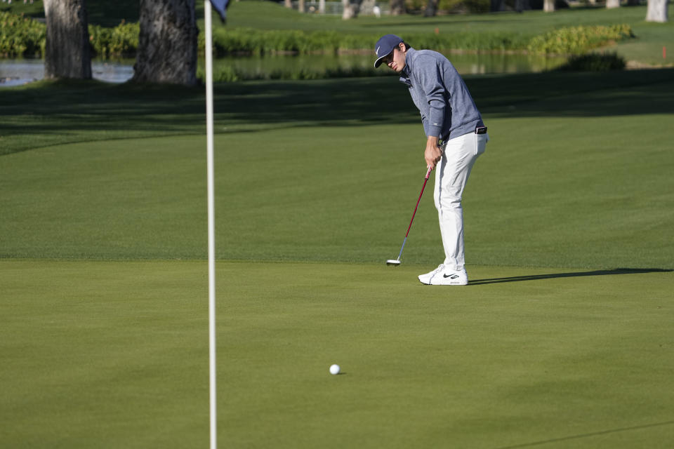 Davis Thompson putts on the 16th green during the American Express golf tournament on the La Quinta Country Club Course Thursday, Jan. 19, 2023, in La Quinta, Calif. (AP Photo/Mark J. Terrill)