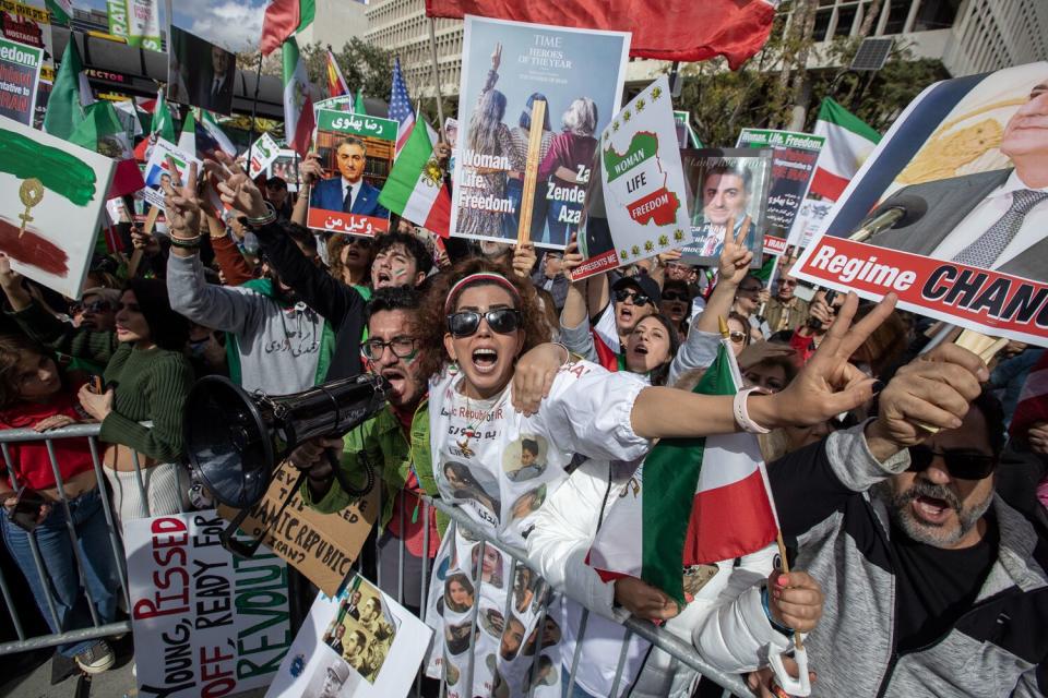 Sepehr Khosravi, left, and Nasrin Nav, right, in the center of a protest