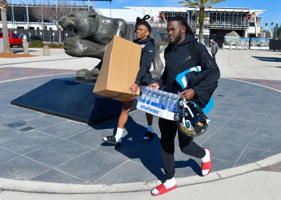 Jaguars cornerback Chris Claybrooks (6) and cornerback Tevaughn Campbell (29) leave the stadium as they clean out their lockers to end the season.