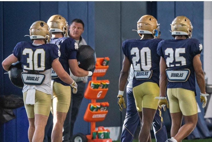 Former LSU football coach Ed Orgeron (center) watches Notre Dame spring practice on April 12, 2022