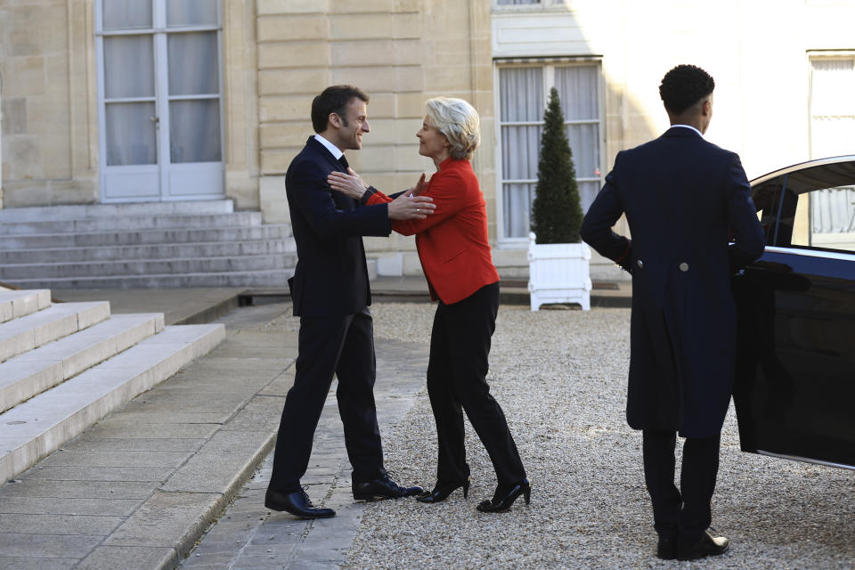 European Commission president Ursula van der Leyen is welcomed by French President Emmanuel Macron before a working lunch, Monday, April 3, 2023 at the Elysee Palace in Paris. The two leaders will travel to China later this week. (AP Photo/Aurelien Morissard)