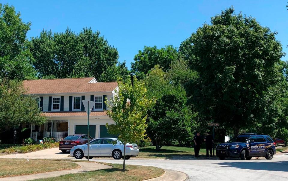 Authorities stand outside the home of Connor Betts on Sunday, Aug. 4, 2019, in Dayton, Ohio. A law enforcement official identified Betts, 24,  as the shooter who killed multiple people and injured dozens at an entertainment complex called the Oregon District during the early morning of Sunday, Aug. 4, 2019.