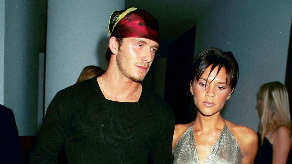 In 1999, the Beckhams attended the launch of Jade Jagger’s jewelry line in London. David wore a silk headscarf, while Victoria stepped out in cow-print heels and a halter-neck chainmail top. - Dave Benett/Hulton Archive/Getty Images