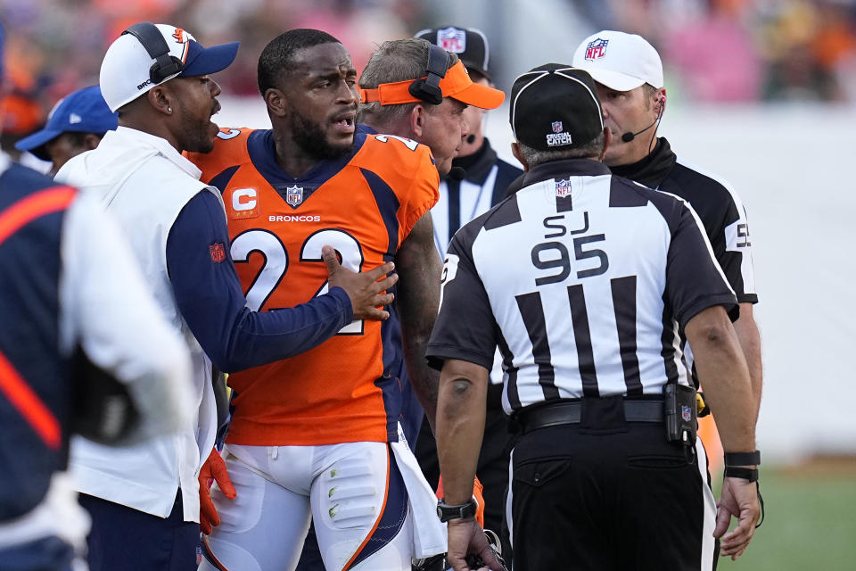 Denver Broncos safety Kareem Jackson (22) reacts to being disqualified from the game after a hit on Green Bay Packers tight end Luke Musgrave during the second half of an NFL football game in Denver, Sunday, Oct. 22, 2023. (AP Photo/Jack Dempsey)