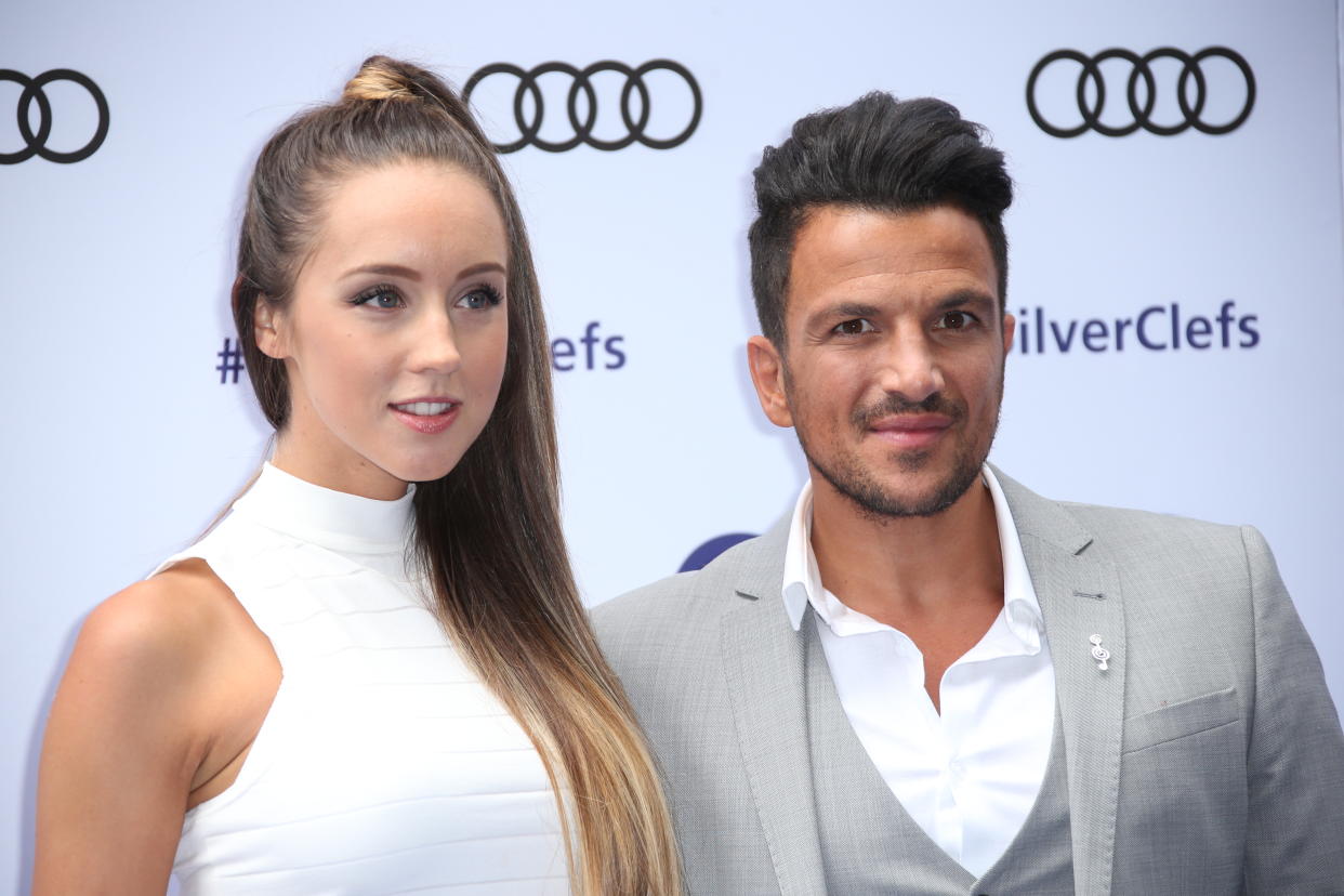 Emily MacDonagh and Peter Andre pose for photographers upon arrival at the Silver Clef Awards in London, Friday, July 1, 2016. (Photo by Joel Ryan/Invision/AP)-