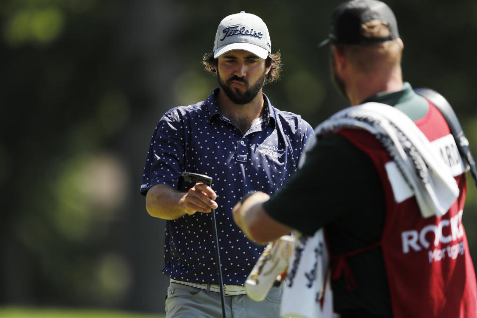 Mark Hubbard walks off the 14th green during the second round of the Rocket Mortgage Classic golf tournament, Friday, July 3, 2020, at the Detroit Golf Club in Detroit. (AP Photo/Carlos Osorio)