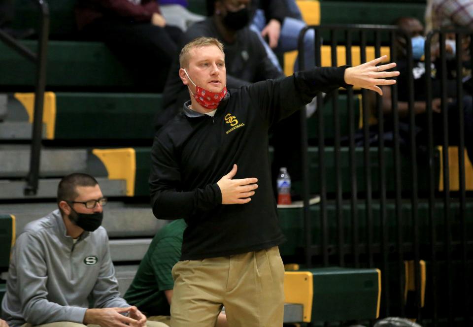 Salina South's girls head basketball coach Justin Ebert tells his players to move back during their game against Buhler Tuesday night, Dec. 7, 2021. Salina South defeated Buhler 60-50, Coach Ebert's first career win as head coach.