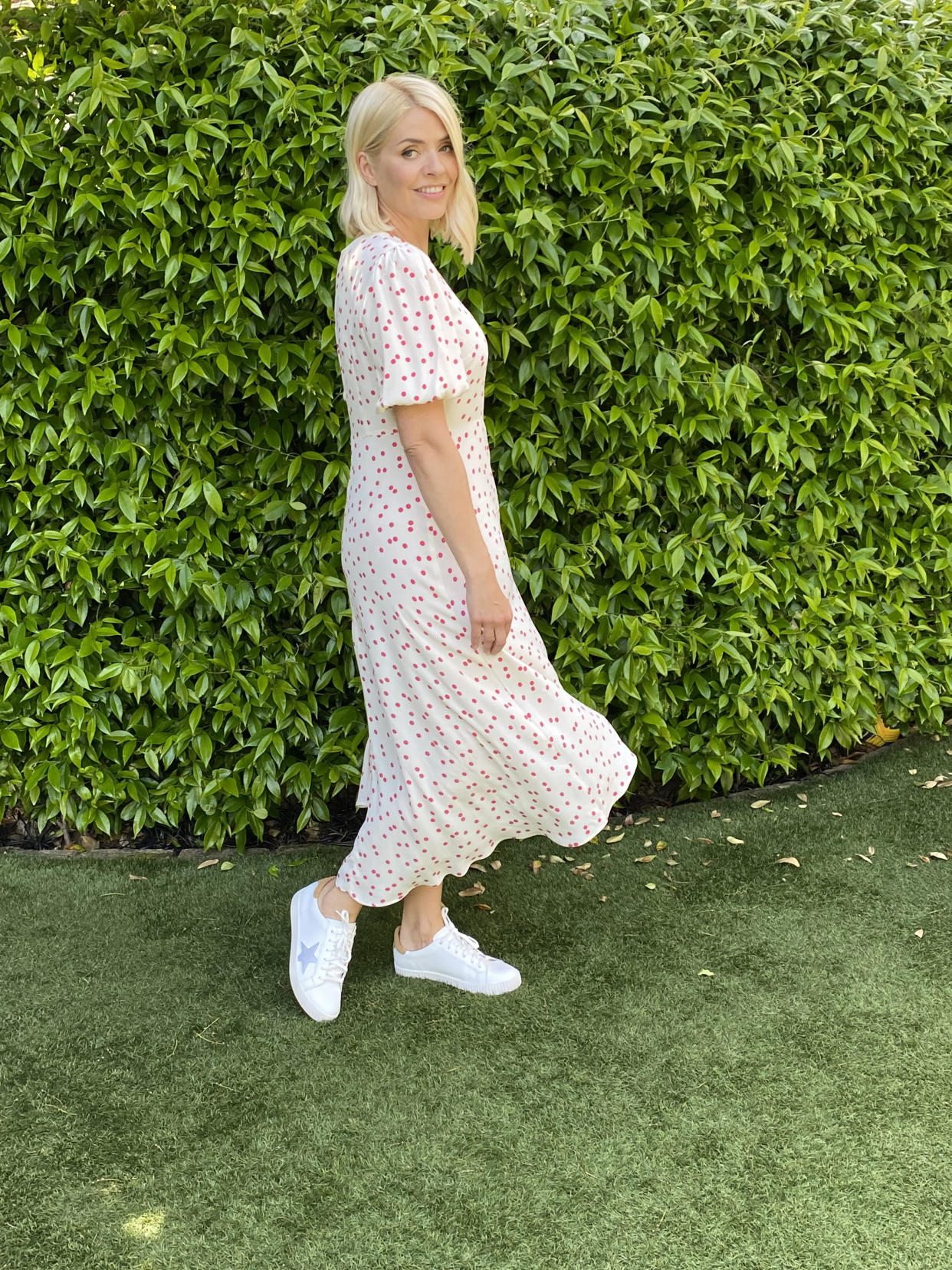 Holly Willoughby pairs her M&S Polka Printed Midi Dress with star print trainers for a more casual look.  (Marks and Spencer)