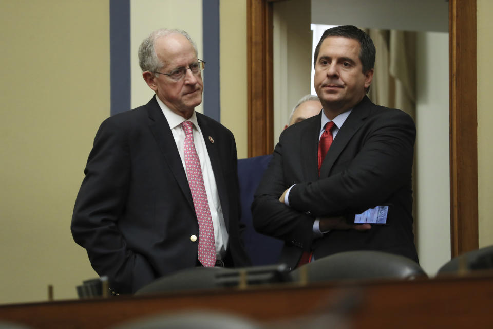 Ranking member Rep. Devin Nunes, R-Calif., talks to Rep. Mike Conaway, R-Texas, after Acting Director of National Intelligence Joseph Maguire testified before the House Intelligence Committee on Capitol Hill in Washington, Thursday, Sept. 26, 2019. (AP Photo/Andrew Harnik)