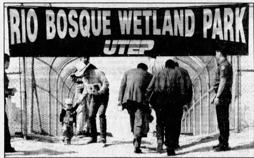 April 8, 1997: Socorro City Rep. Gilbert "Tito" Lujan and his son Justin made their way beneath the sign at the entrance to the Rio Bosque Wetland Park.