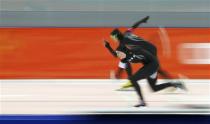 Heather Richardson of the U.S. and Lauren Cholewinski of the U.S. skate during the women's 500 metres speed skating race at the Adler Arena during the 2014 Sochi Winter Olympics February 11, 2014. REUTERS/Marko Djurica