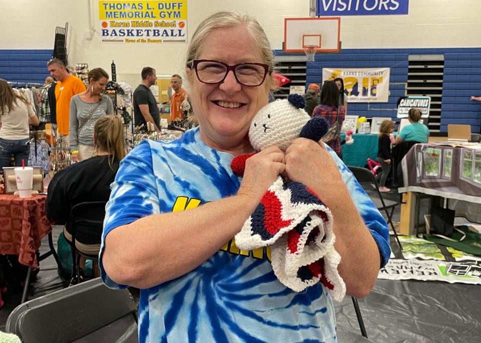 Home crafter Tina Squailia works for Karns Elementary and makes crochet unicorns and dinosaurs in her spare time. She said she hoped small kids would take them home as “lovies.”